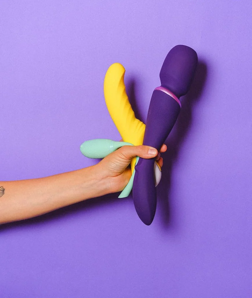 hand holding sex toys